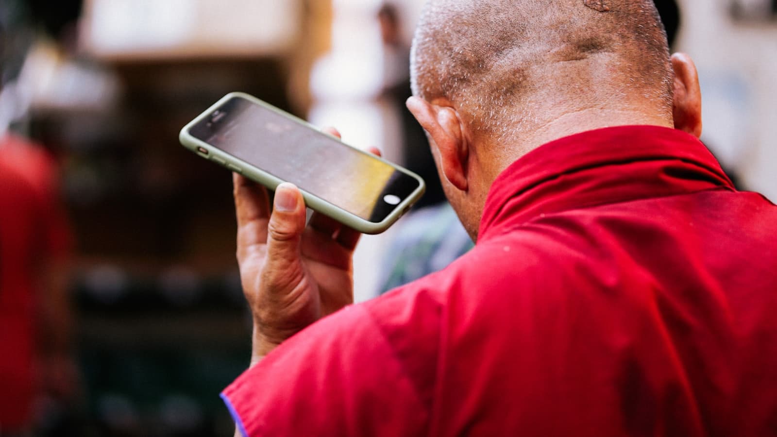 Worker holding a phone during a shift
