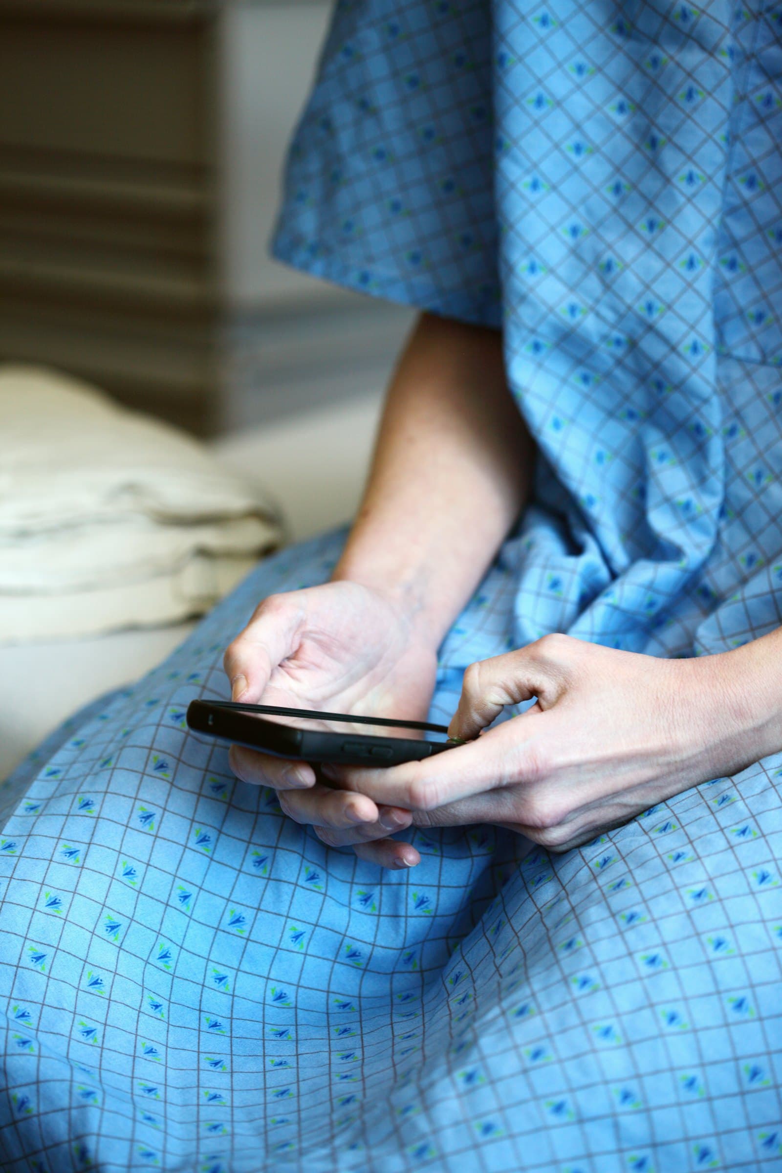 A patient using a phone